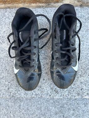 Nike Black Youth Athletic cleats with White Swoosh